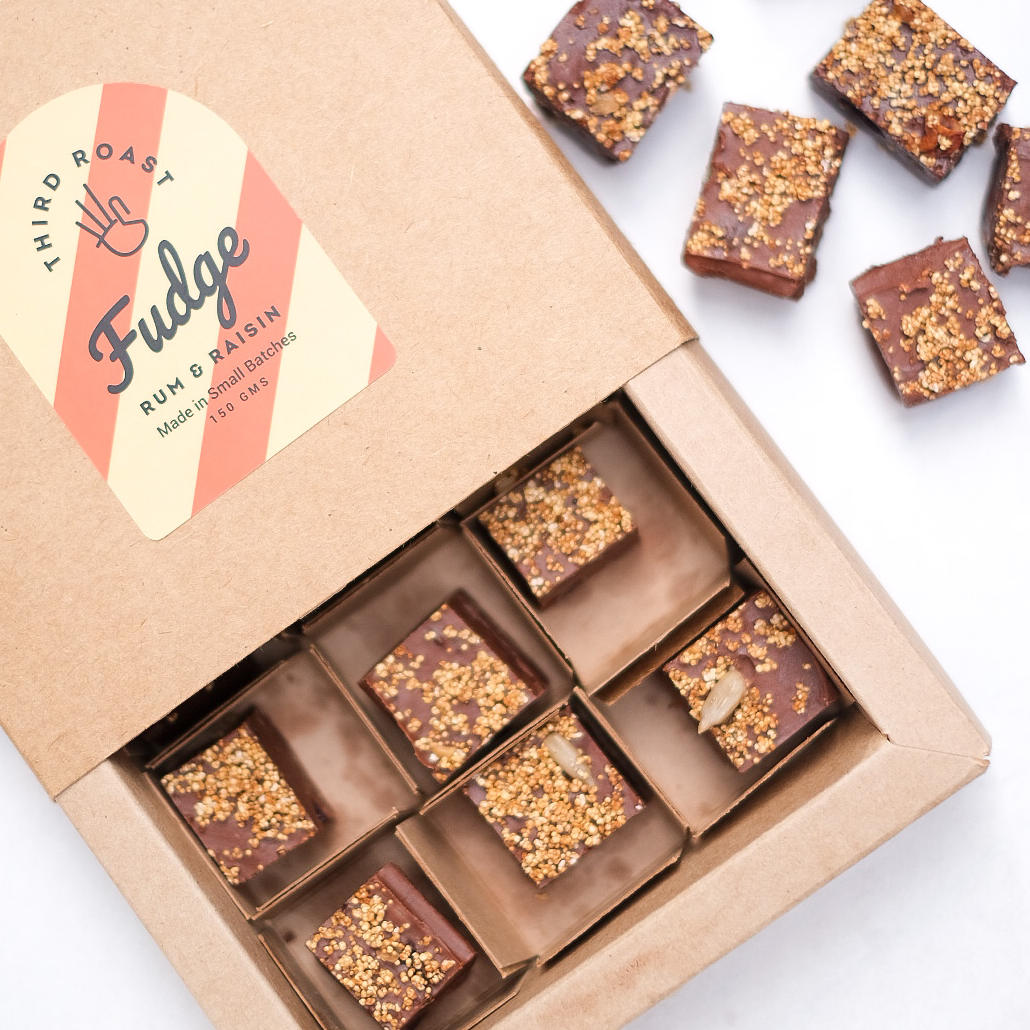 top shot of a delectable dark chocolate fudge pieces in a brown sliding customised gift box 